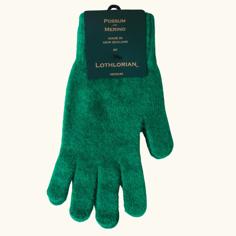 Emerald green possum and merino wool gloves flat lay on white background
