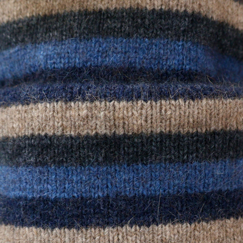 Possum and merino wool blue striped beanie close up of fabric. Warm, soft and comfortable unisex winter beanie