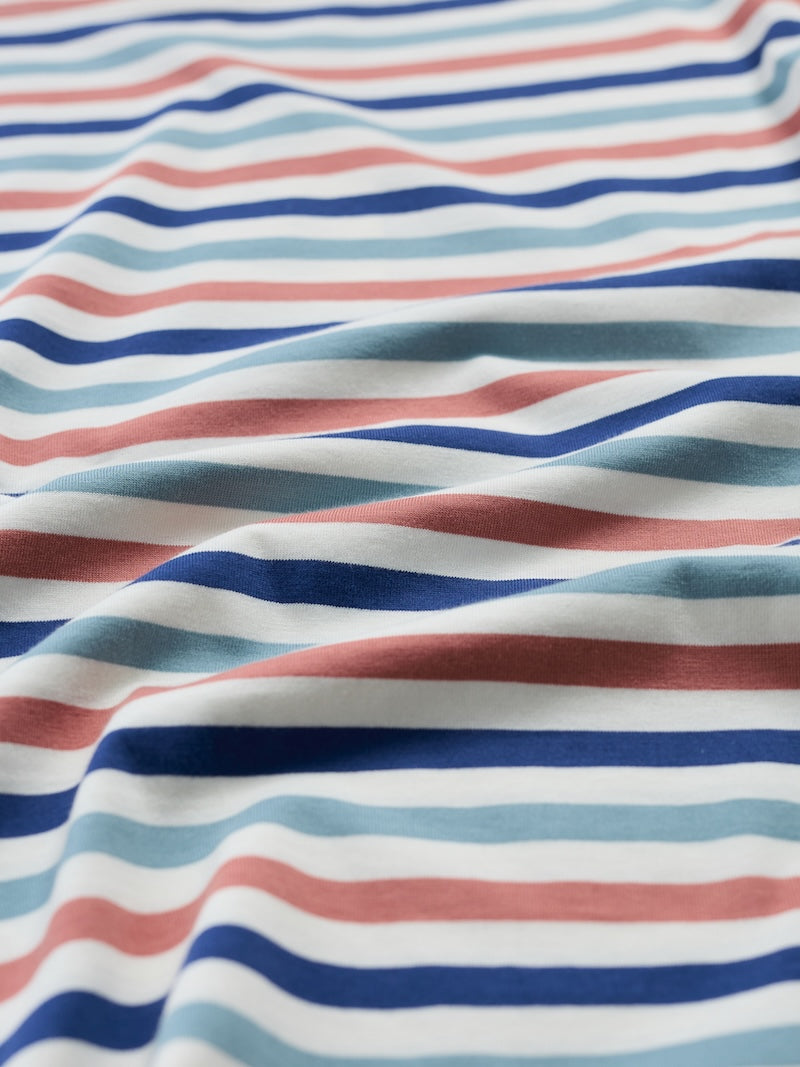 Close-up of striped fabric with red, blue, and white colors.
