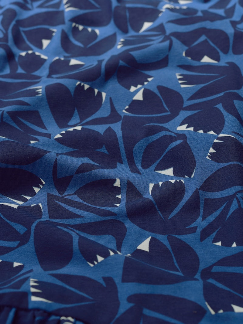Blue fabric with abstract leaf pattern