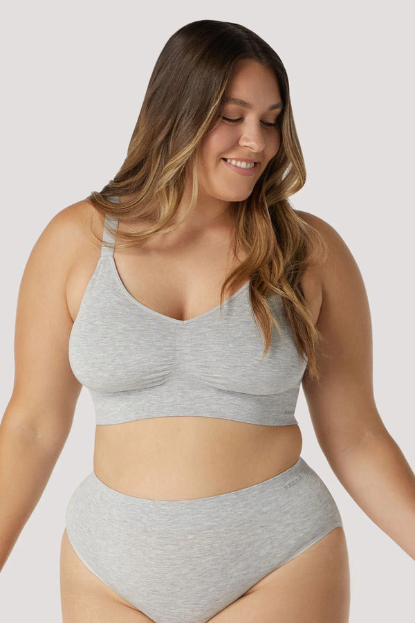 Woman wearing grey Bamboo Adjustable Crop bra. Sustainable, wire free bra with adjustable straps. Bra with removable cups