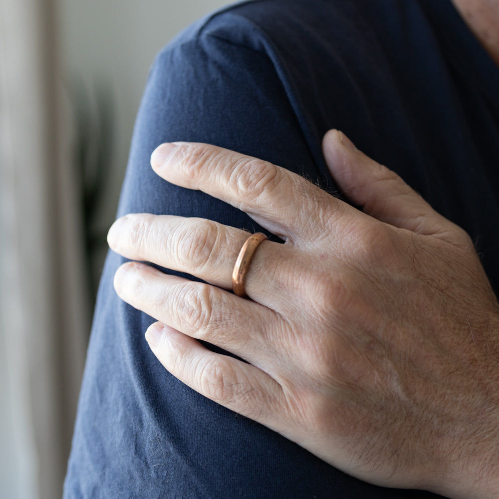 Man wearing a copper ring
