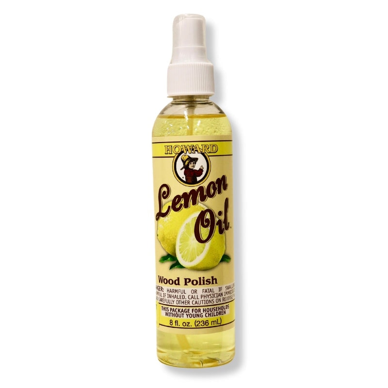 Howards lemon oil wood polish yellow spray bottle on white background. Cleans & polishes wood surfaces without drying. Enhances depth, tone, natural beauty of wood grain. Made from lemon rinds.