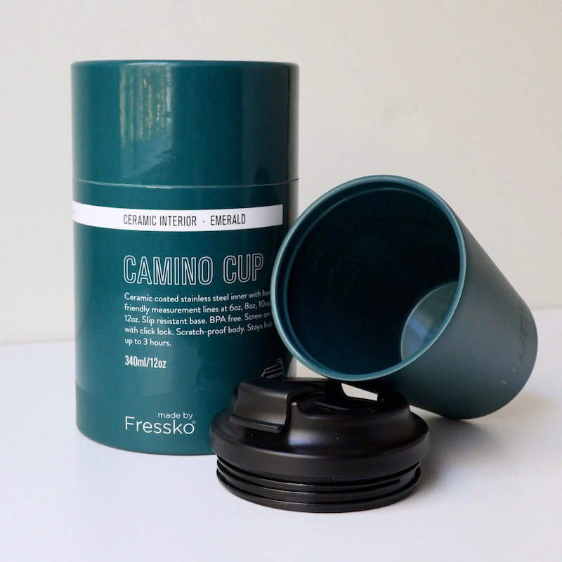 Emerald blue Fressko Ceramic reusable coffee cup with black spill proof lid on white background. Stays hot for up to 3 hours. Chemical-free, lightweight & insulated stainless steel coffee cup