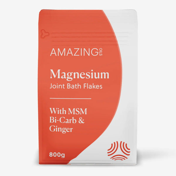 Magnesium Joint Bath Flakes in white & orange packet on white background. Supports joints, soothes muscle tension & promotes restful sleep. Enhances circulation & improves skin health.