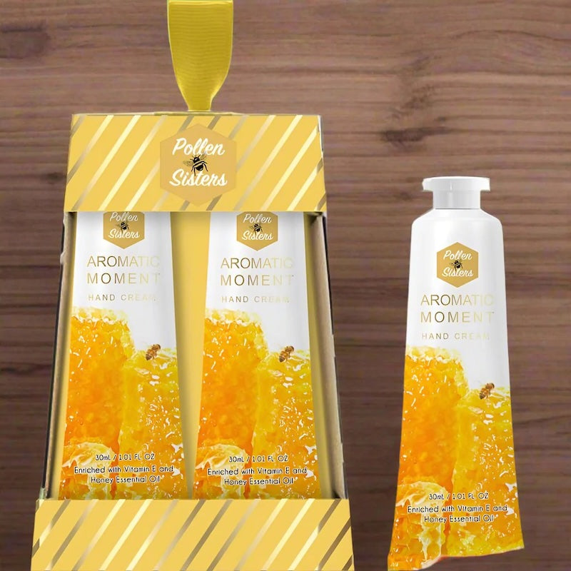 2 pack of organic honey hand cream in white and orange tube in white and gold packaging. Nourishing & moisturising hand cream made from pure organic honey.