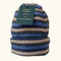 Possum and merino wool blue striped beanie with possum and merino tag on white background. Warm, soft and comfortable unisex winter beanie
