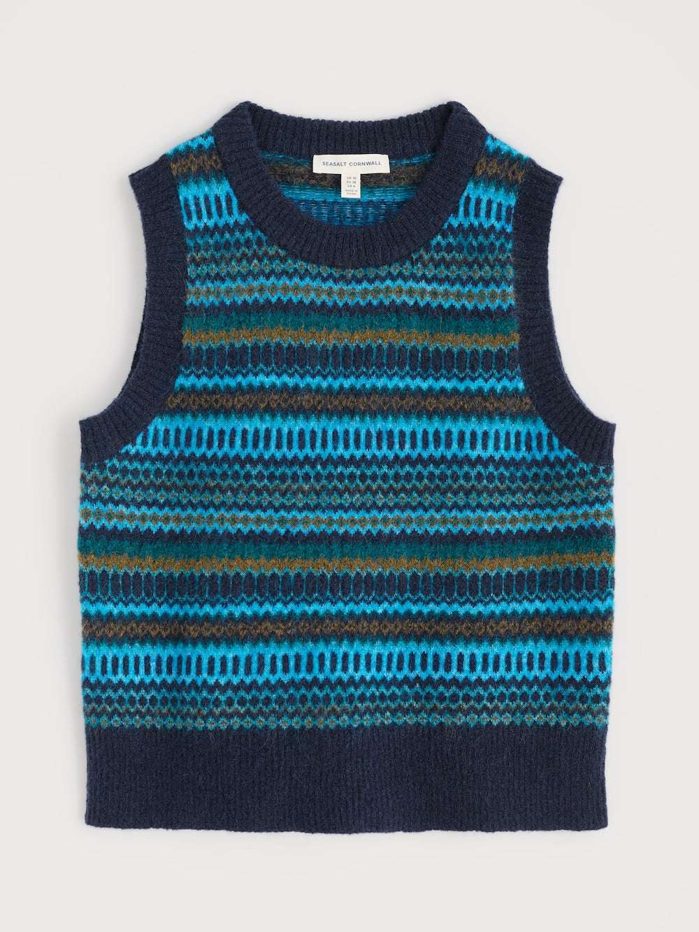 Knitted sleeveless sweater vest with blue and brown pattern on a light gray background