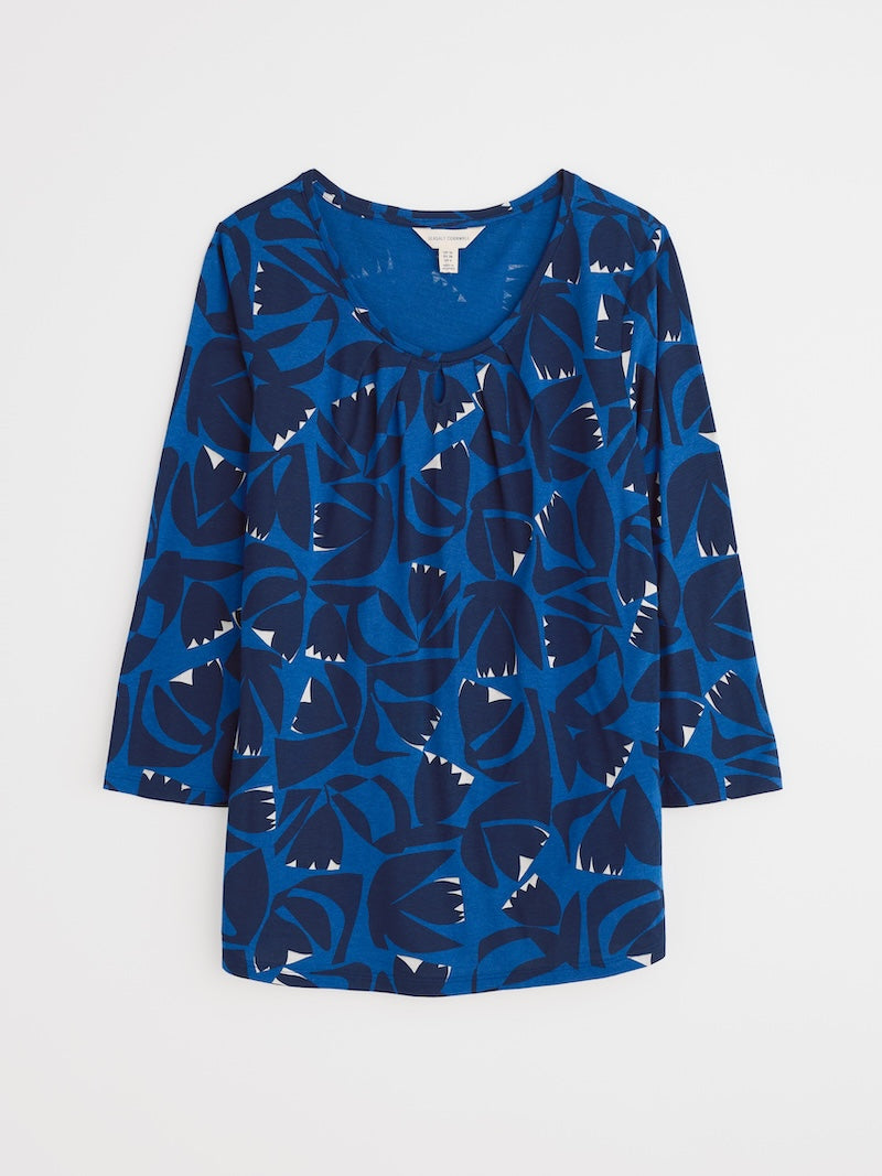 Blue patterned blouse on a white background
