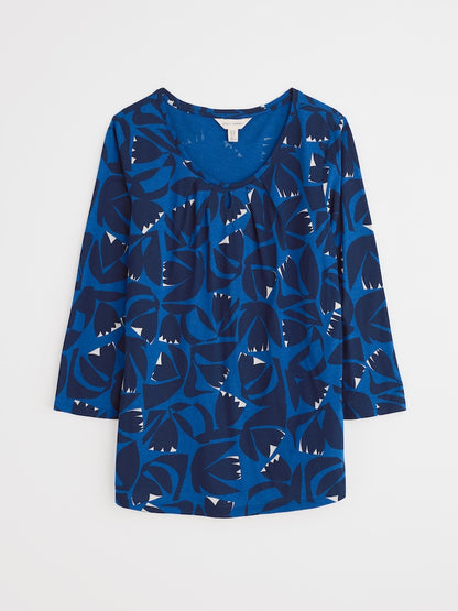 Blue patterned blouse on a white background