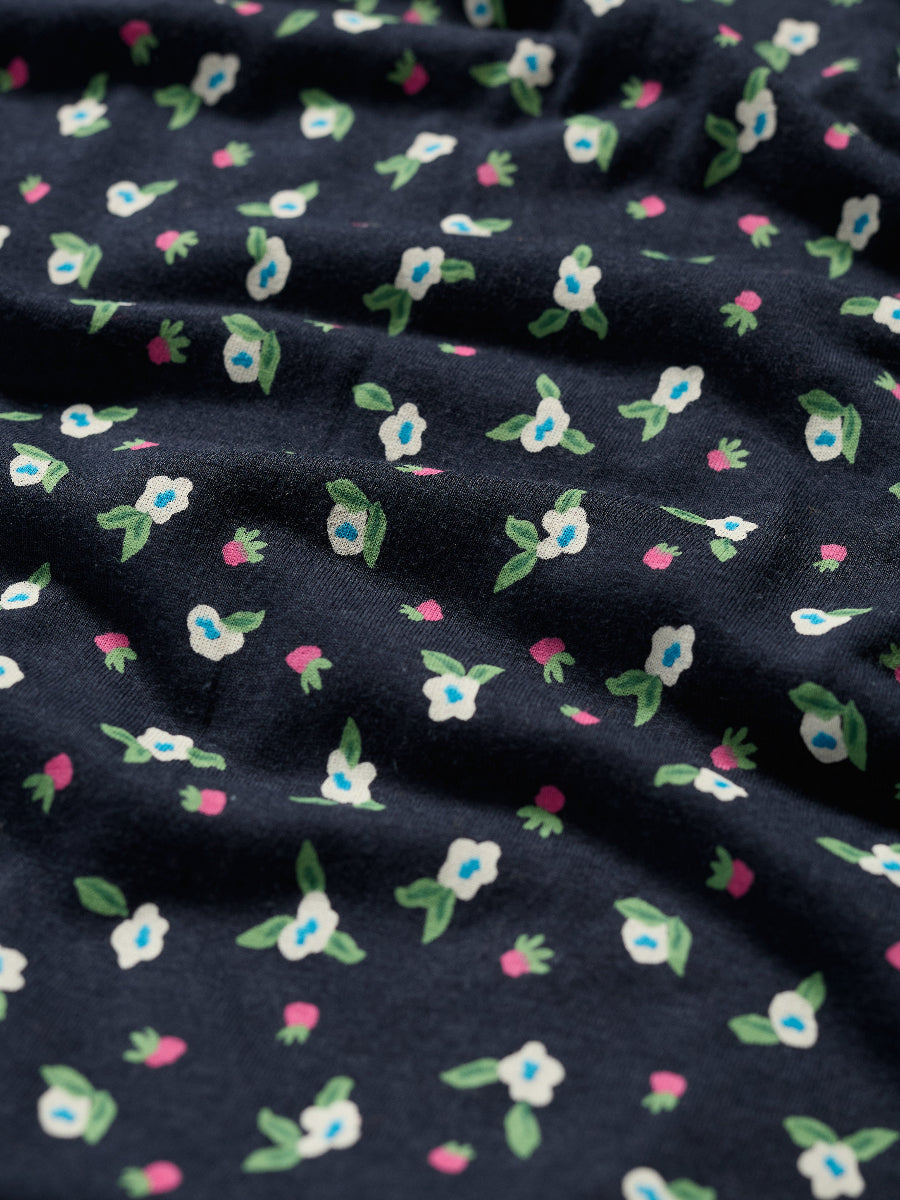 Navy blue fabric with small colorful floral patterns