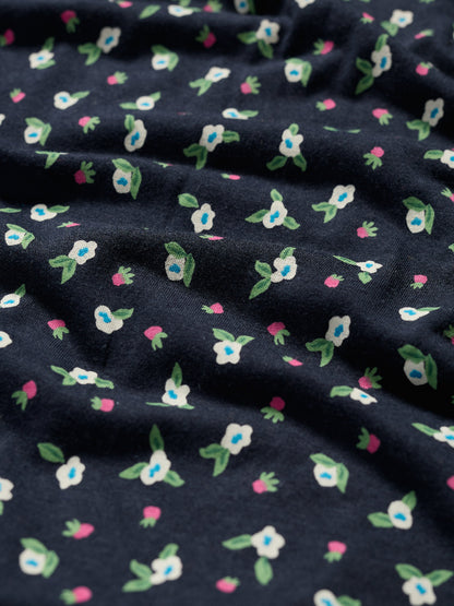 Navy blue fabric with small colorful floral patterns