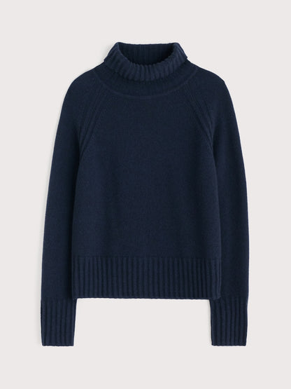 Navy blue sweater on a light gray background