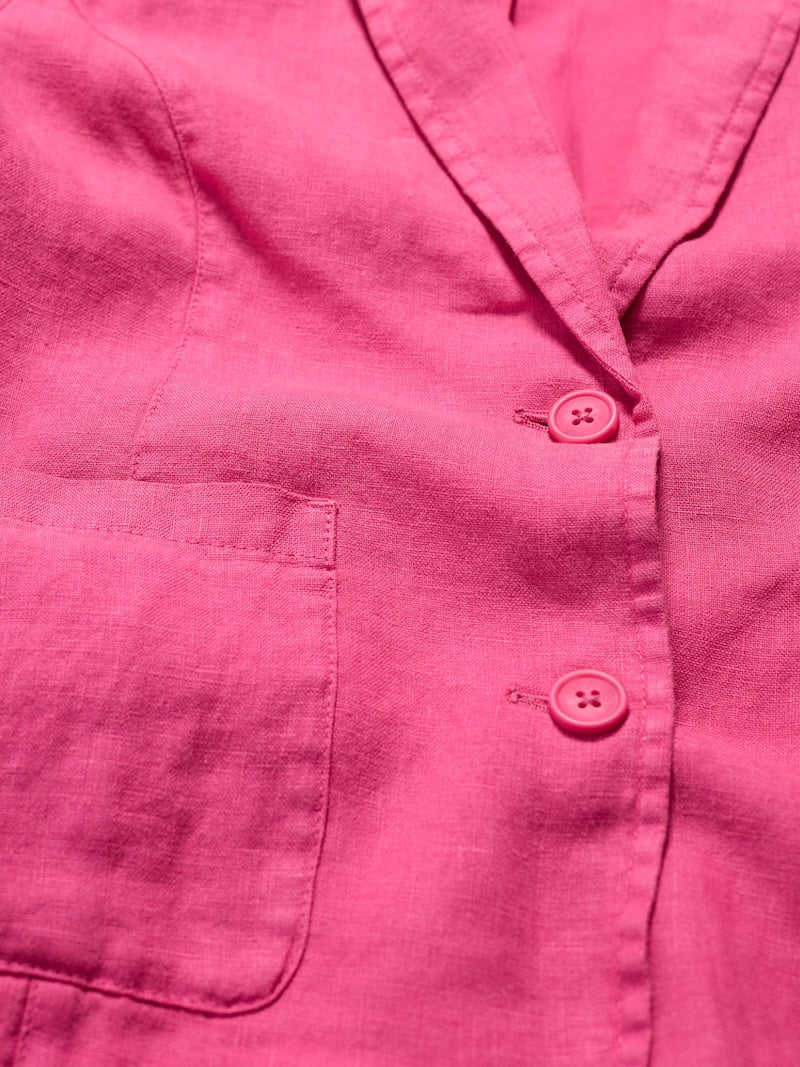Close-up of a pink jacket with buttons and a pocket