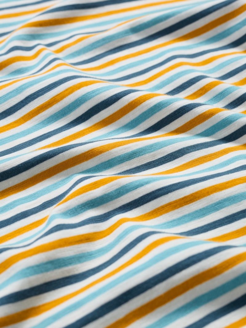Close-up of fabric with blue, yellow, and white stripes.