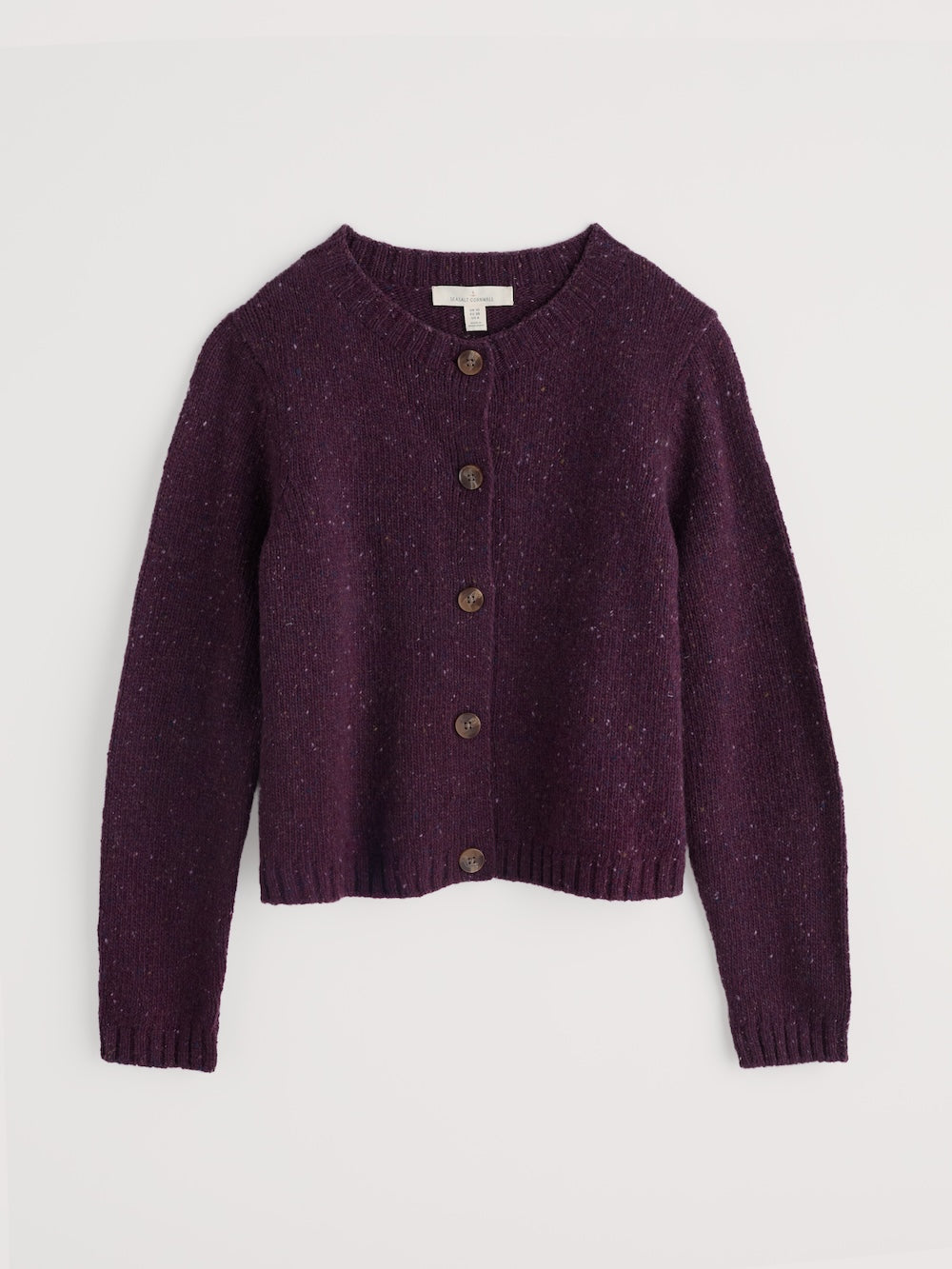 Purple cardigan with buttons on a light grey background