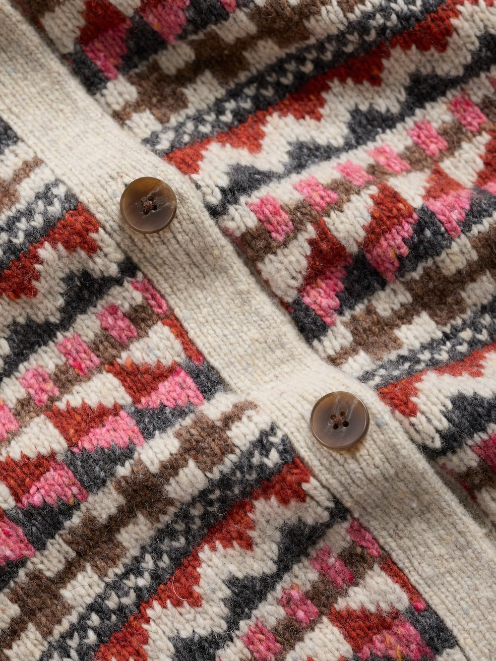 Close-up of a patterned vest with buttons