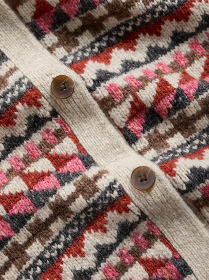 Close-up of a patterned vest with buttons