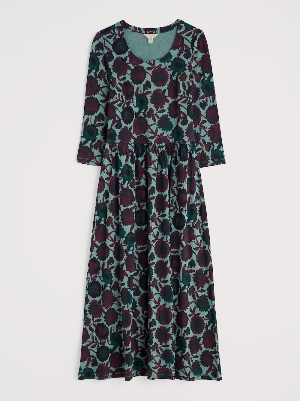 Long floral dress with a pattern of purple and green on a white background