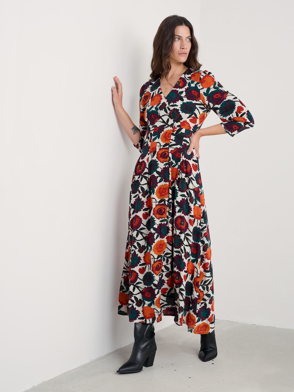 Woman wearing a floral dress with a white background