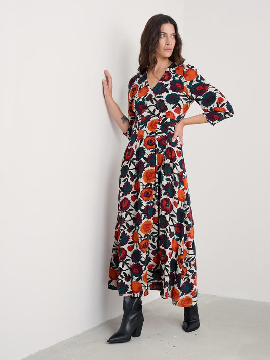 Woman wearing a floral dress with a white background