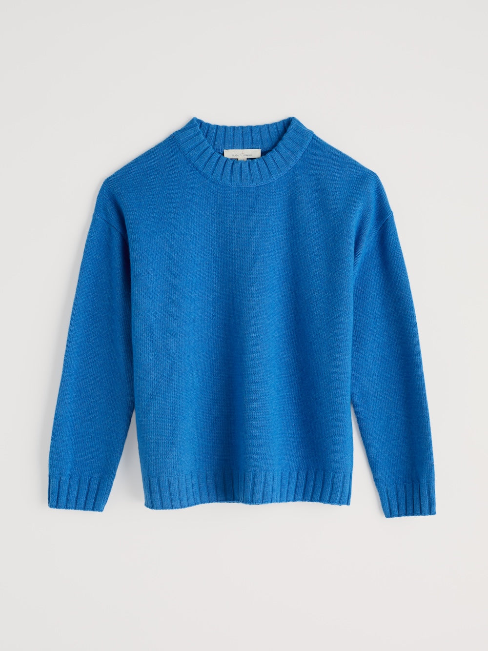 Blue sweater on a light gray background