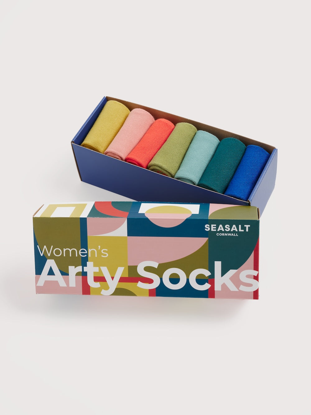 Box of women's arty socks with colorful packaging on a white background