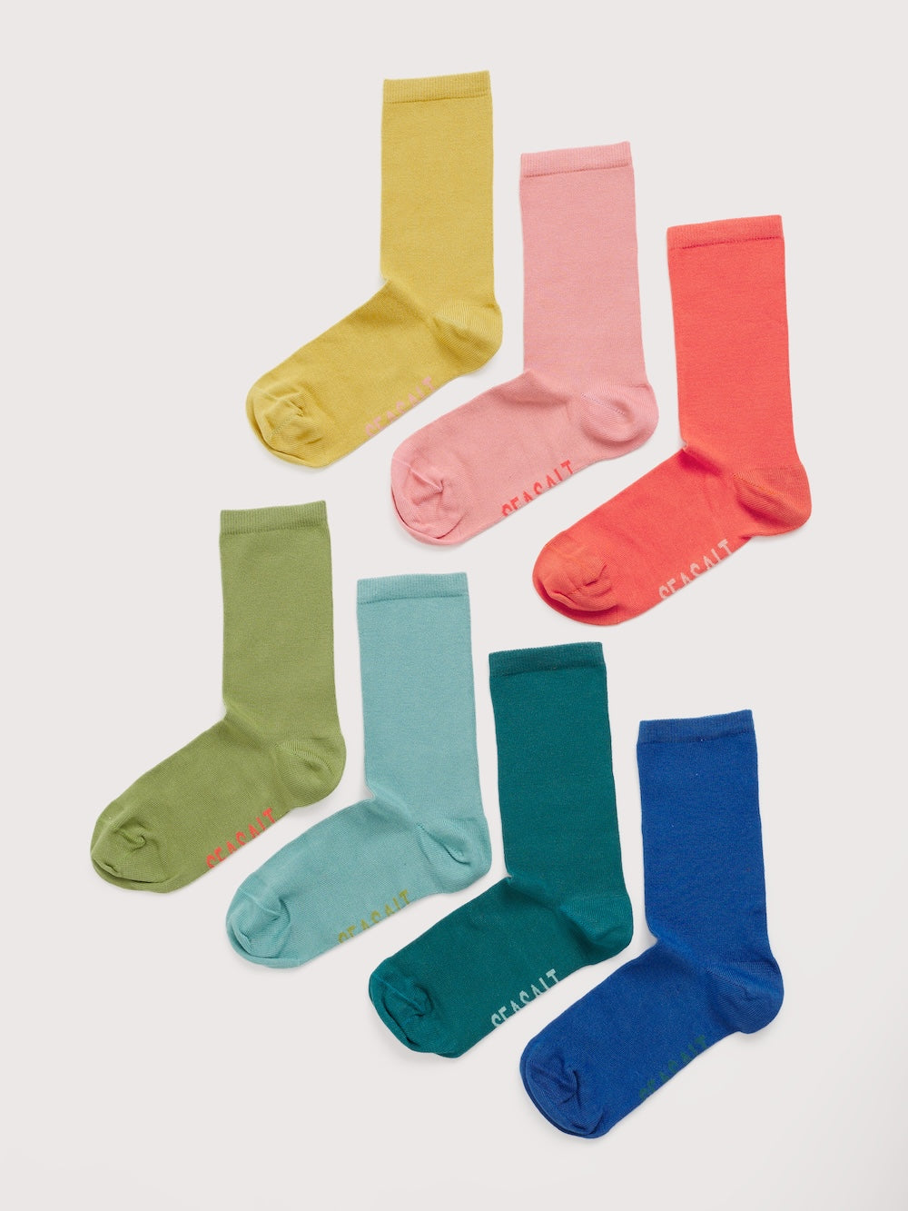 Set of colorful socks in various shades on a white background