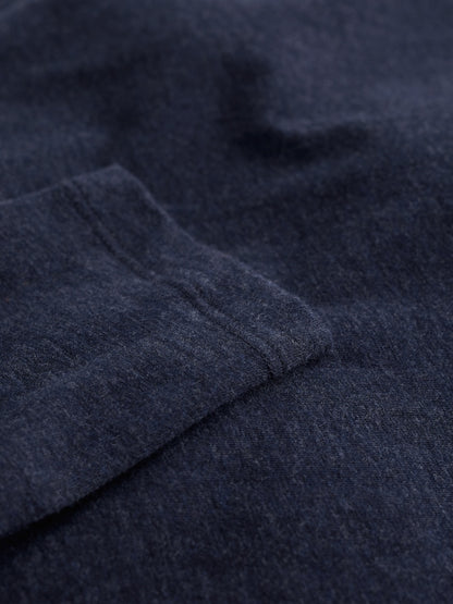Close-up of dark blue fabric with a subtle pattern