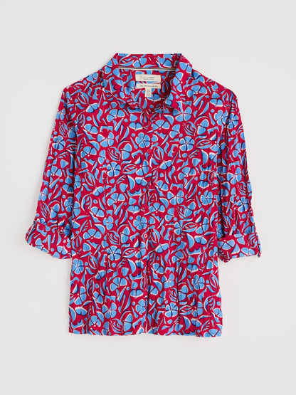 Red and blue floral patterned shirt on a white background