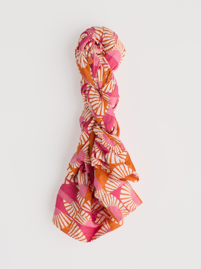 Colourful patterned rolled shirt on a white background