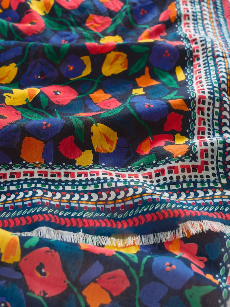 Colourful fabric with floral and geometric patterns