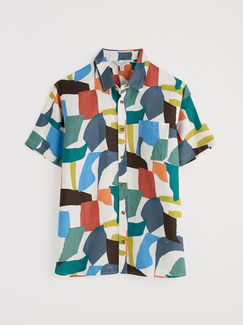 Colourful geometric patterned shirt on a white background