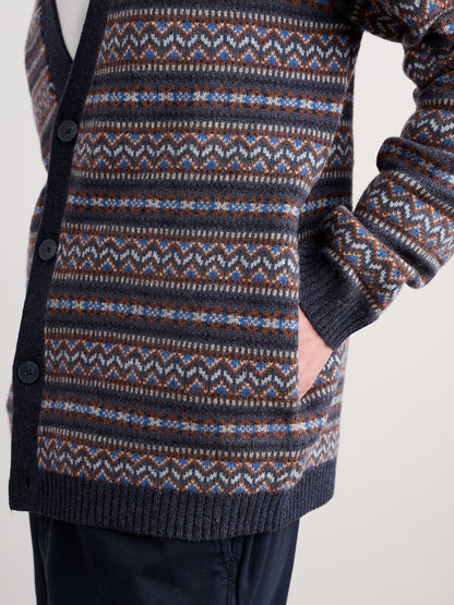 Patterned cardigan with a focus on the fabric design against a neutral background