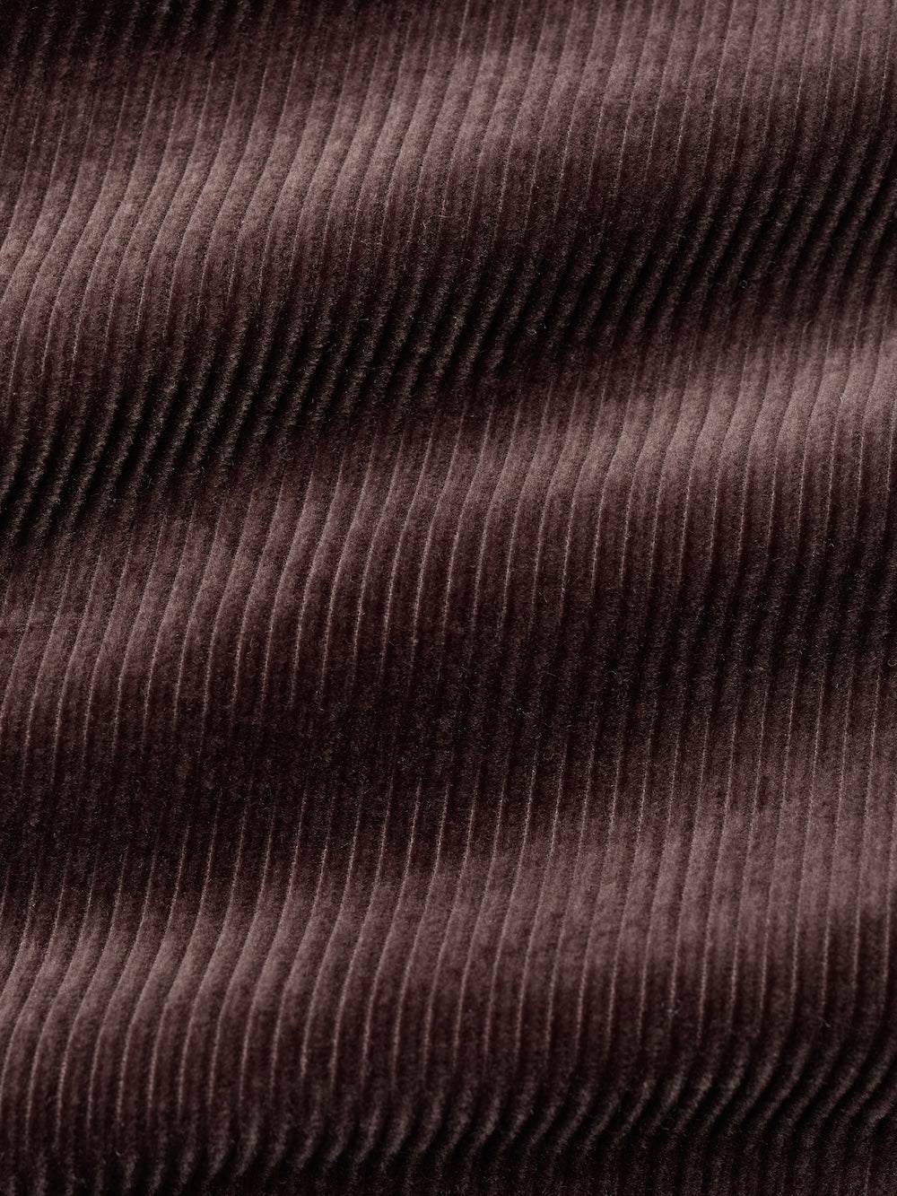 Close-up of brown corduroy fabric with visible texture