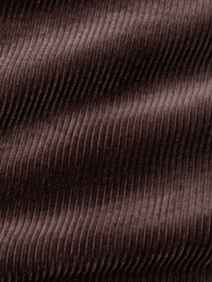 Close-up of brown corduroy fabric with visible texture