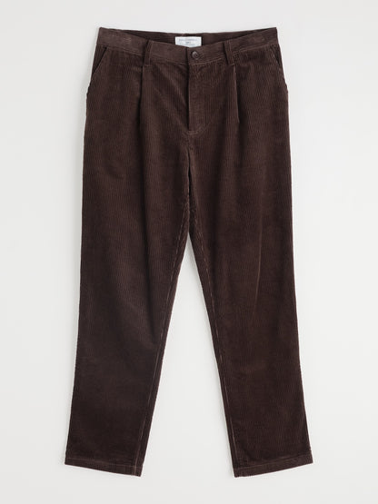 Brown corduroy pants on a white background