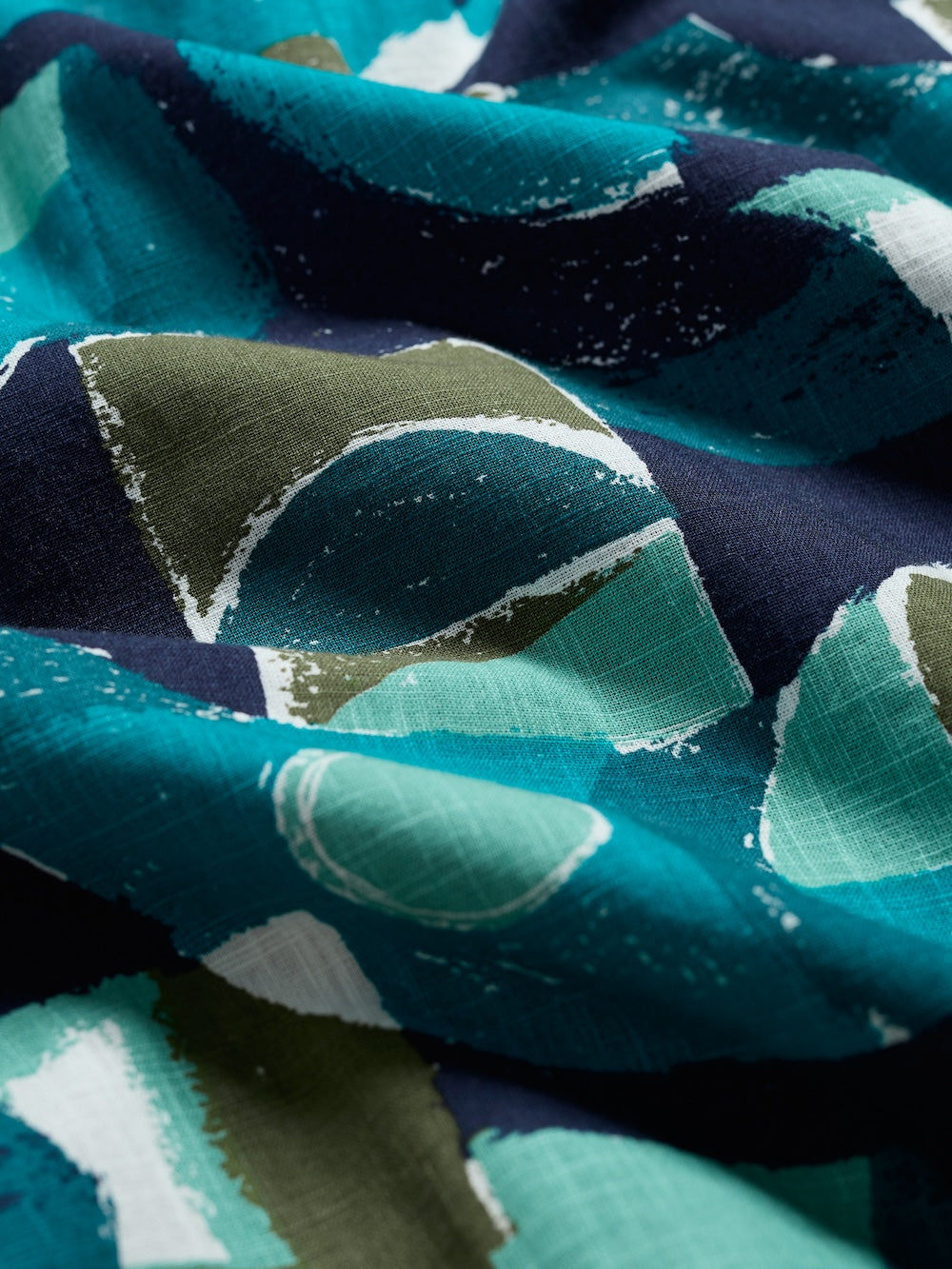 Close-up of fabric with green and blue pattern