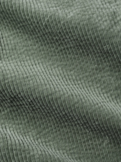Close-up of green corduroy fabric texture