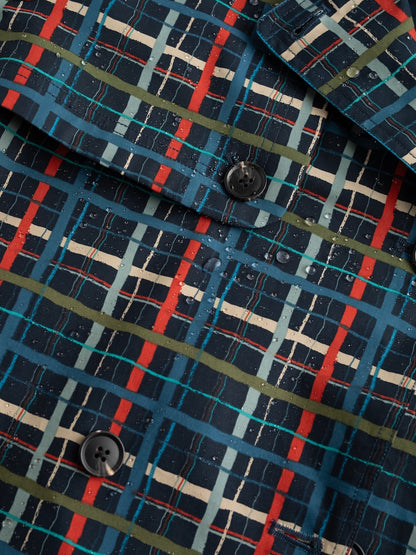 Close-up of a plaid jacket with blue, red, and green colours.