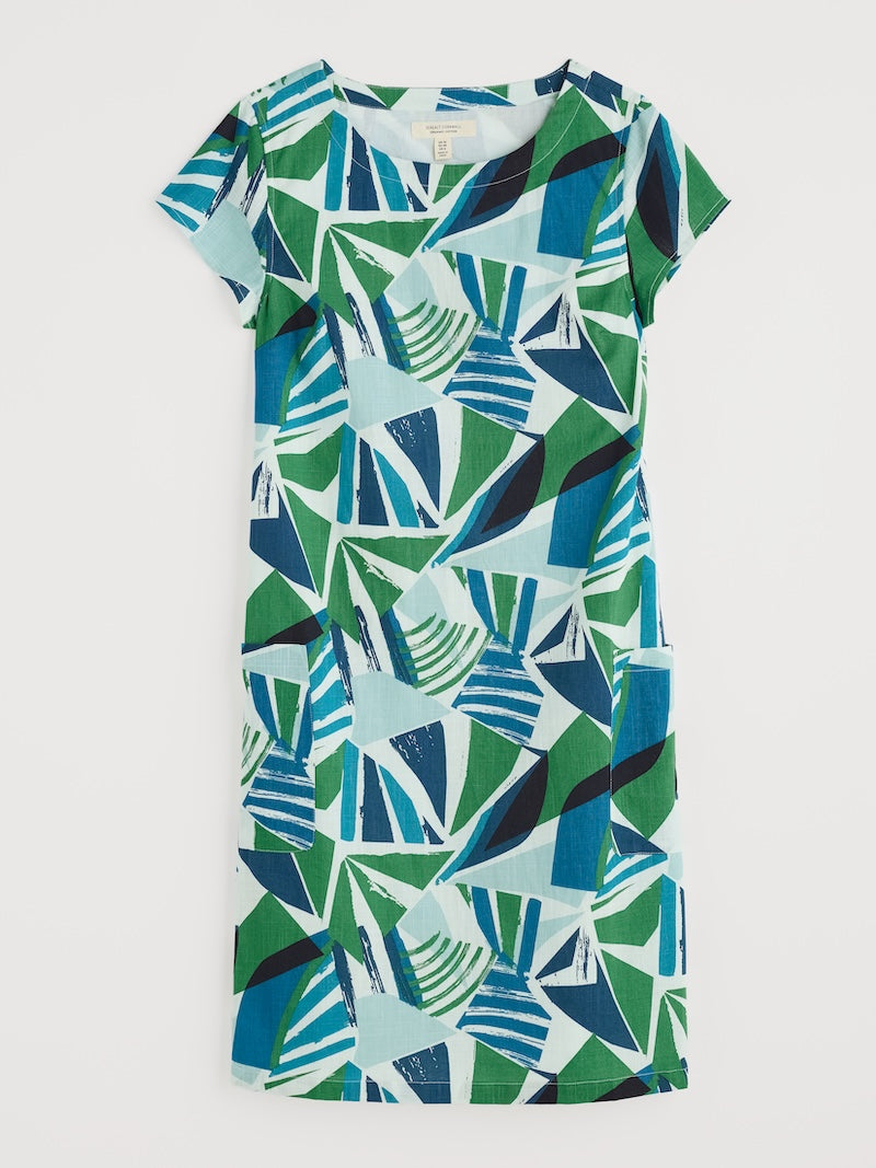 Green and blue geometric patterned dress on a white background