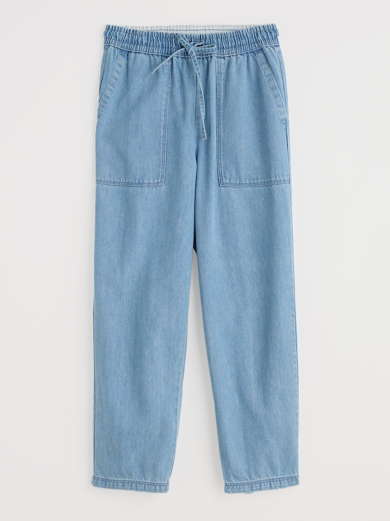 Light blue denim pants with drawstring on a white background