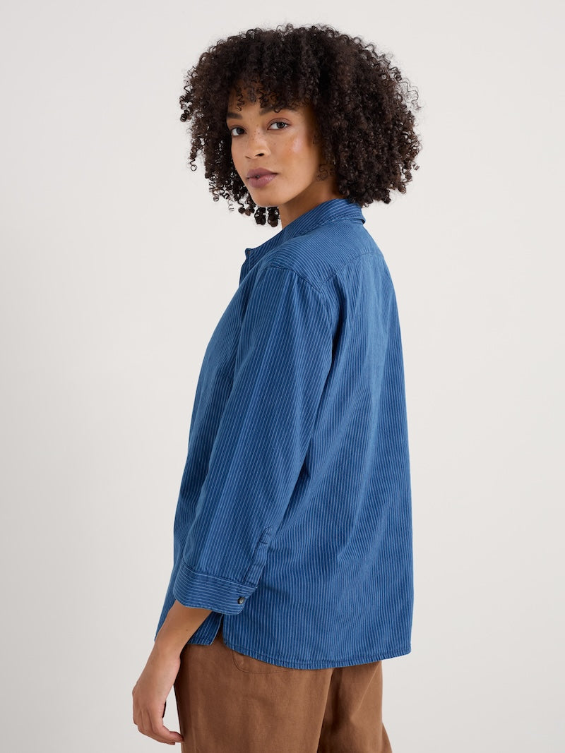 Woman wearing a blue shirt on a white background