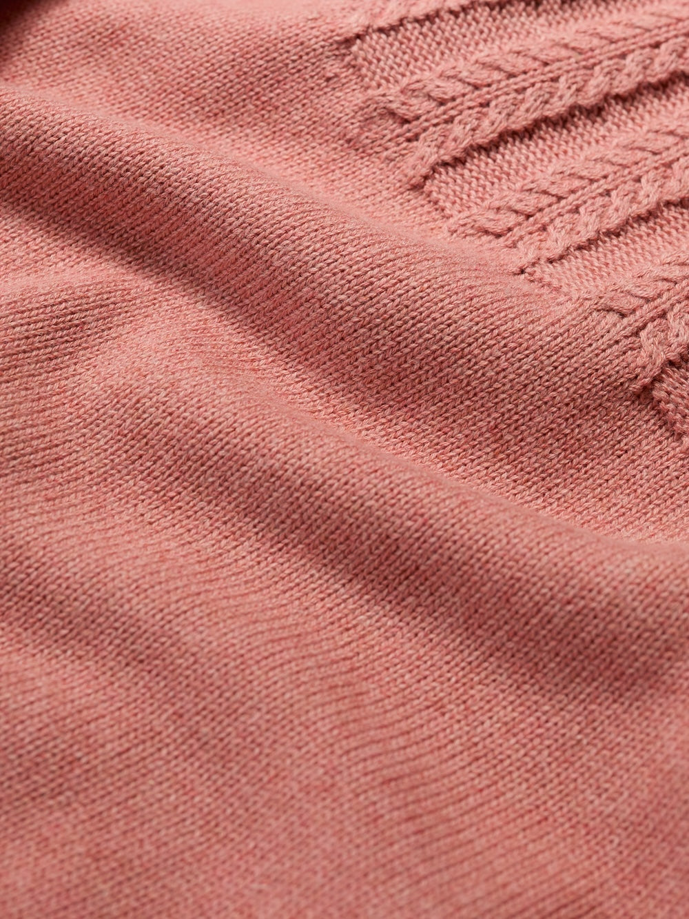 Close-up of pink fabric with textured pattern