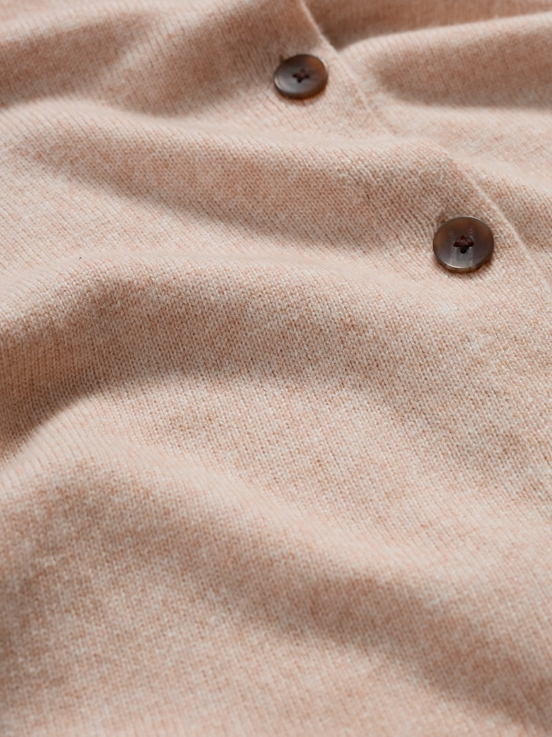 Close-up of a beige fabric with buttons