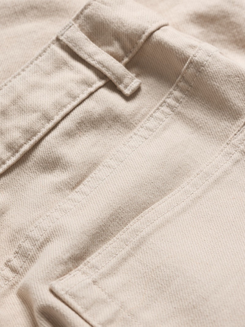 Close-up of beige fabric with stitching details