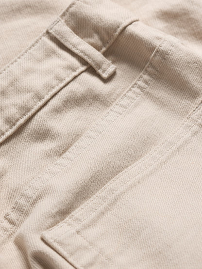 Close-up of beige fabric with stitching details