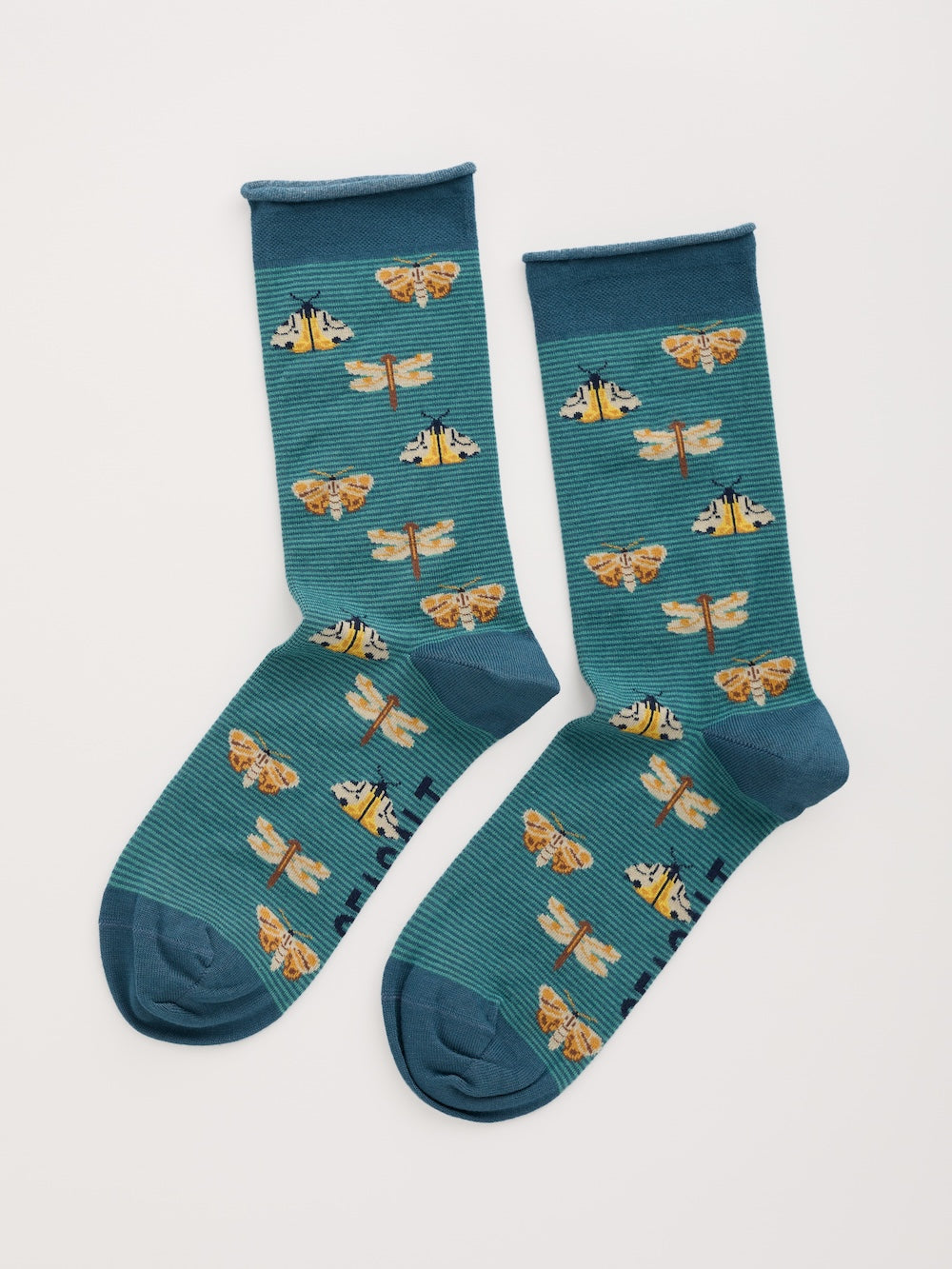 Teal socks with dragonfly and butterfly pattern on a white background