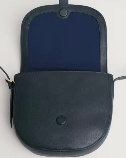 Navy blue leather bag on white background
