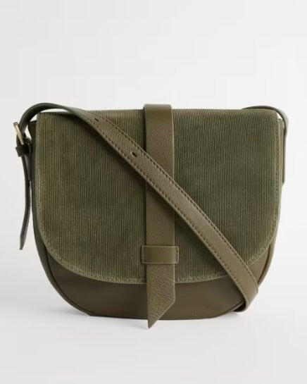 Green corduroy crossbody bag on a white background